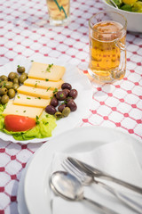 Summer salad with olives, tomatoes and cheese
