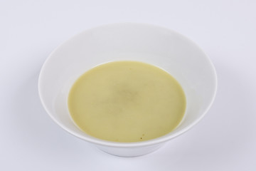 Healthy spinach soup on a white
