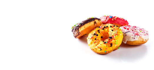 Set of colored donuts on a white background (close up)