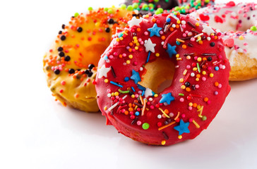 Set of colored donuts on a white background (close up)