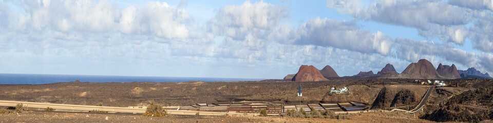 Plakat panoramic view of old and new street in Timanfaya national park
