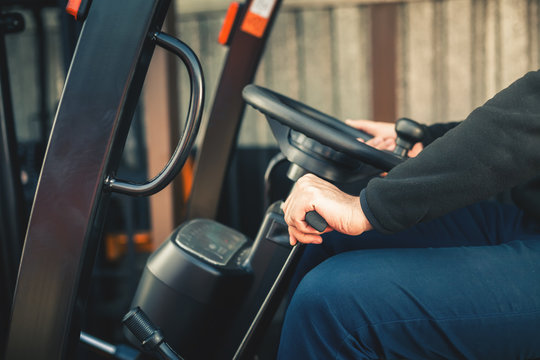 Closeup Man drives a reliable heavy truck loader