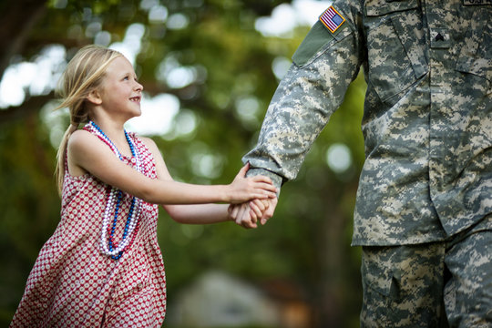 Father and daughter walking outdoors