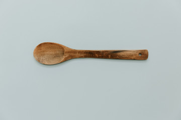 Kitchen wood utensils on minimal pastel background
