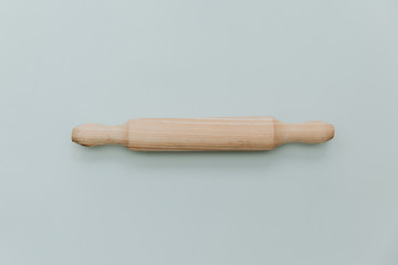 Kitchen wood utensils on minimal pastel background
