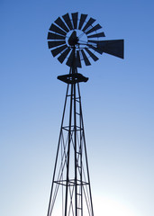 Silhouette of Windmill with Blue Sky Behind