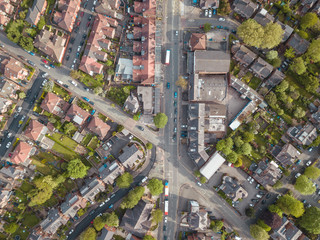 Residential houses drone above aerial view blue sky with park and greenery  © Sam Foster