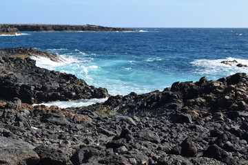 Vulcanic black coast in Caleta de Fuste, Fuerteventura
