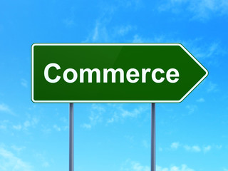 Business concept: Commerce on green road highway sign, clear blue sky background, 3D rendering