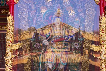 Chinese warrior and glass reflection in Yuantong Temple (Kunming, Yunnan)