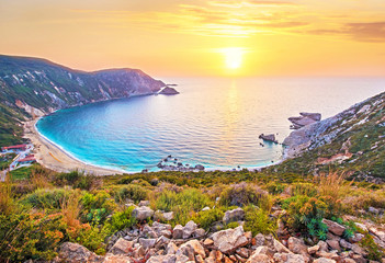 Obraz premium Fantastically beautiful scenery with the beach at sunset in Petani Beach, Kefalonia, Greece. Amazing places. Tourist Attractions.