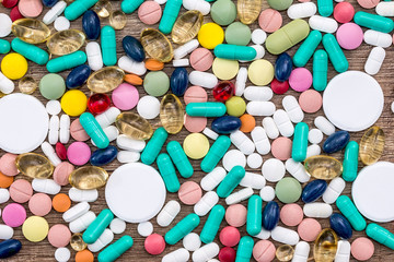 many colored tablets on desk . close up