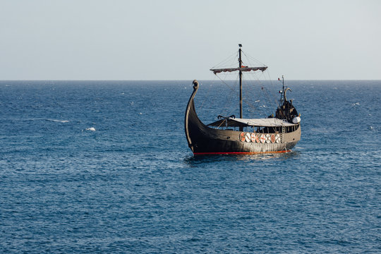old black ship in the open sea