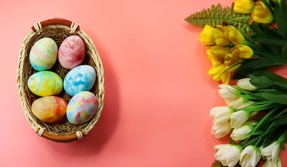 chicken eggs. home-made watercolor. artificial flowers. Easter background.