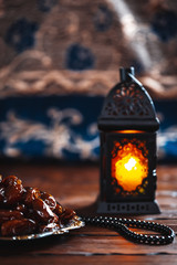 The Muslim feast of the holy month of Ramadan Kareem. Beautiful background with a shining lantern...