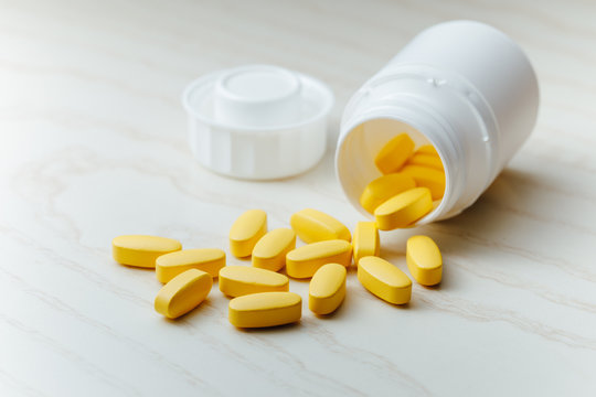 nutrition supplements, yellow multivitamin pills