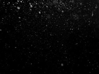 snow on black background, white spots on black
