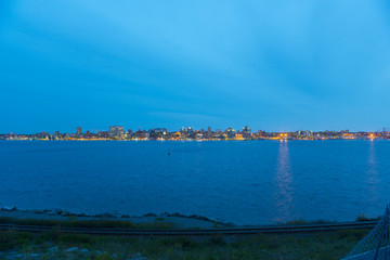 Halifax City skyline at night from Dartmouth waterfront, Nova Scotia, Canada.