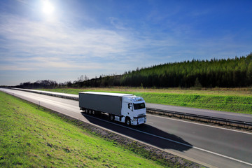 Truck transportation on the road at sunset