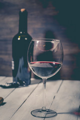 bottle and glass with red wine