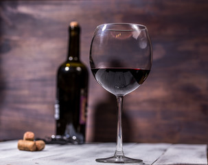 bottle and glass with red wine