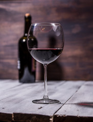 bottle and glass with red wine