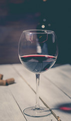 bottle and glass with red wine