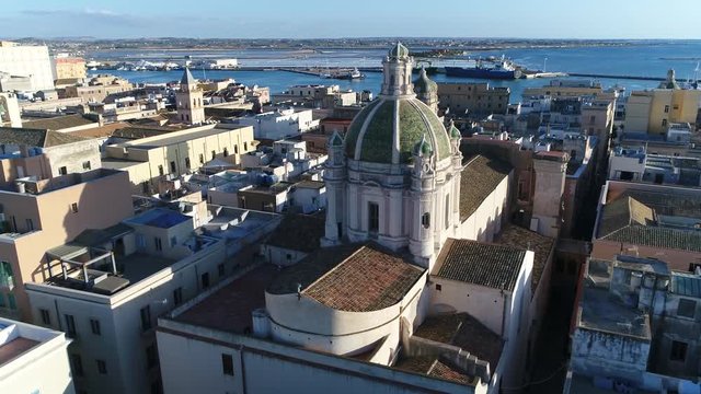 Aerial view panning around Trapani Cathedral dome or Basilica of St. Lawrence the Martyr is cathedral of Roman Catholic Diocese of Trapani dedicated to Saint Lawrence in Trapani Sicily Italy 4k
