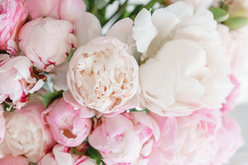 Naklejka na ściany i meble Lovely flowers in glass vase. Beautiful bouquet of white and pink peonies . Floral composition, daylight. Summer wallpaper. Pastel colors