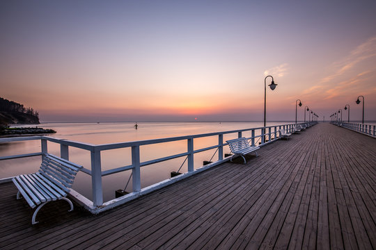 Amazing colorful sunrise over the pier in Gdynia Orlowo. Sunrise over the sea. © R_Szatkowski