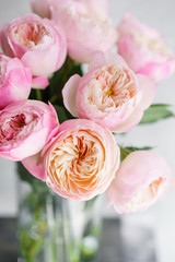 English garden peonies roses, David Austin. Multi color pink flower bud, floral background photo. Lovely flowers in glass vase. Beautiful summer bouquet. Floral composition, daylight. Wallpaper