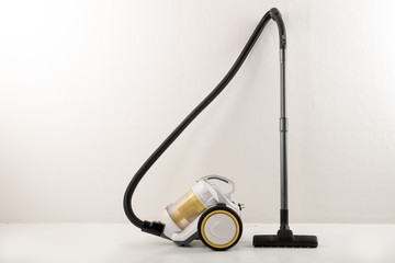 Yellow-white vacuum cleaner white background