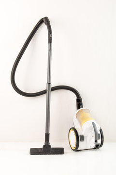 Yellow-white vacuum cleaner white background