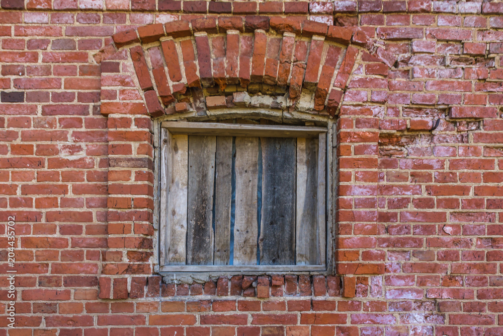 Wall mural old broken window on brick wall background