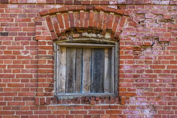 Fototapeta na wymiar old broken window on brick wall background