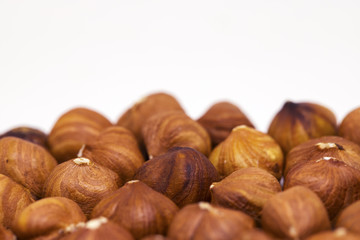 Hazelnut pile closeup. Hazelnut photo background. Organic food macro banner template.