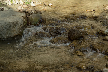 Russia. North Caucasus. Chegem waterfalls. Flowing through the rocks mountain river