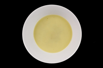 Healthy spinach soup on a black
