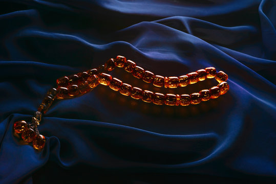 Ramadan Karim greeting background Islamic prayer bead (rosary). Ramadan Kareem beautiful poster, banner, postcard for the celebration of the festival of the Muslim community