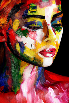 portrait of young woman in colourful paint
