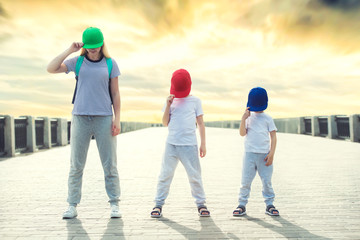 Mother and two son dance hip-hop.Urban lifestyle. Hip-hop generation.	