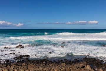 Waves Crashing Ashore Along the Scenic Maui Coast