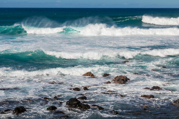 Waves Crashing Ashore Along the Scenic Maui Coast