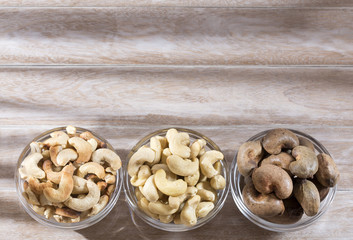 Cashew nut on wooden background - Anacardium occidentale