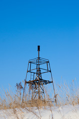 geodesic sign on a background of a blue sky in winter. vertical view.