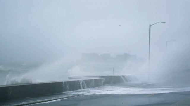Storm Surge and Massive Waves Crash Onto Road