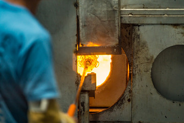 Pocos de Caldas, Minas Gerias/Brazil. Crystal glass melting in hot oven ready to be shaped