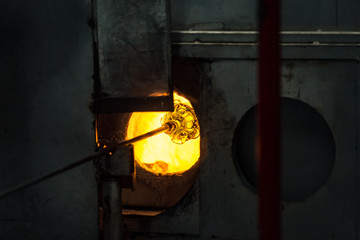 Pocos de Caldas, Minas Gerias/Brazil. Crystal glass melting in hot oven ready to be shaped