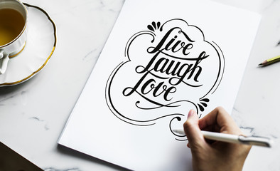 An artist creating hand lettering artwork