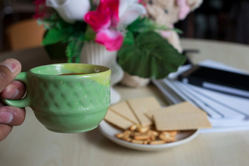 Coffee with  bread  in the morning on Desk for work
